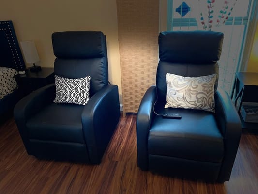 Cozy seating area with two armchairs and decorative pillows