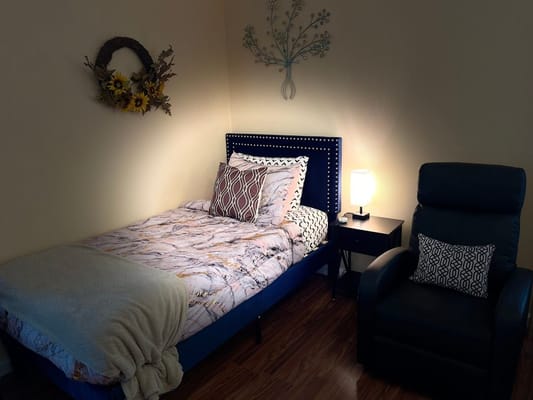 Cozy private room with bed and seating area