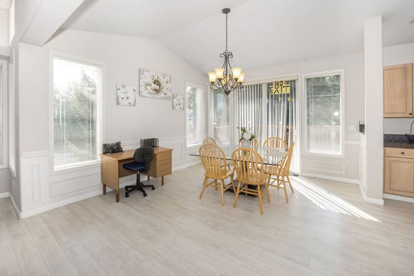 Bright dining area with wooden table and chairs