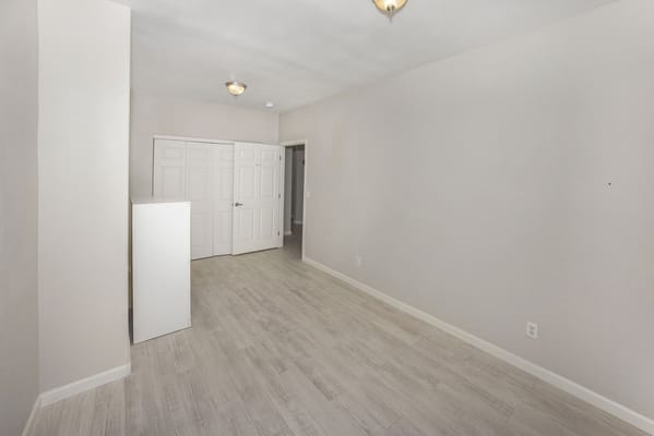 Bright, empty interior room with white walls