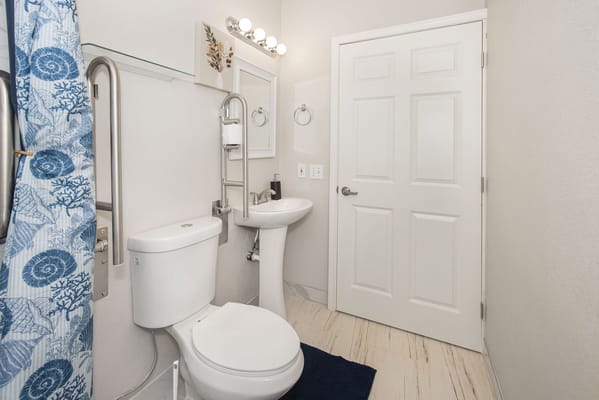 A clean and modern bathroom in a senior living facility