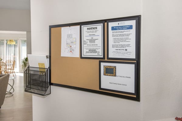 Bulletin board with notices in the facility common area