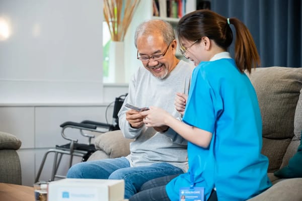 Caregiver and resident engaged in conversation