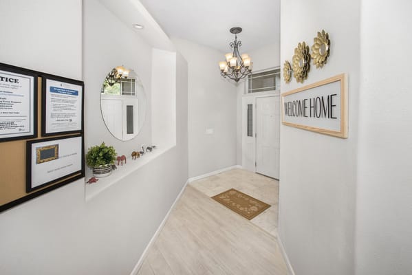 Welcoming interior hallway with decor and signage