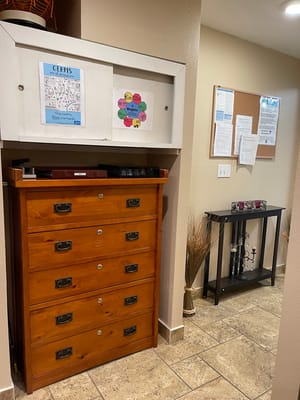 Interior space with bulletin board and furniture