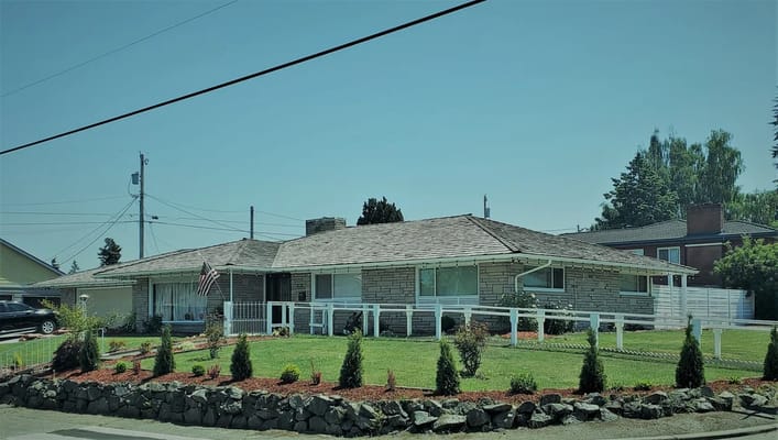 Exterior view of a residential care facility with landscaping
