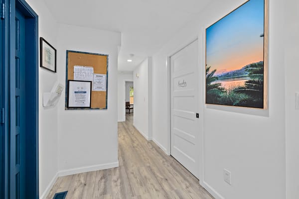 Bright hallway of a senior living facility with decor