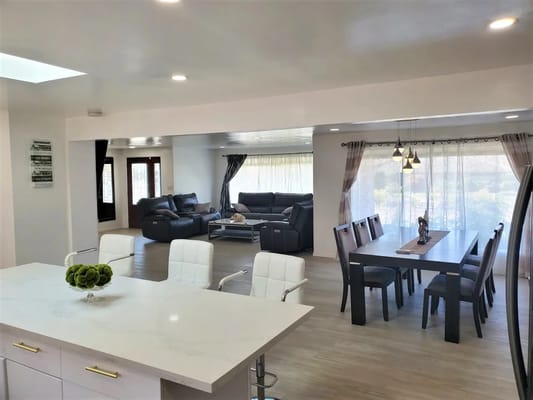 Spacious common area with seating and dining table