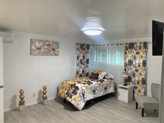 Cozy resident room with floral decor and single bed