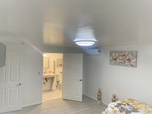 Interior view of a resident room with bathroom access