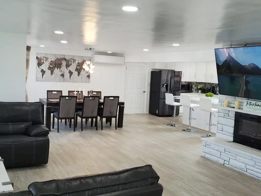 Bright common area with dining and lounge space