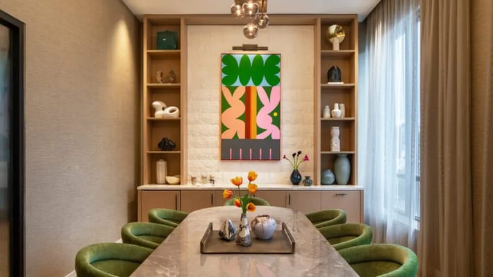 Modern interior space with vibrant artwork and dining area