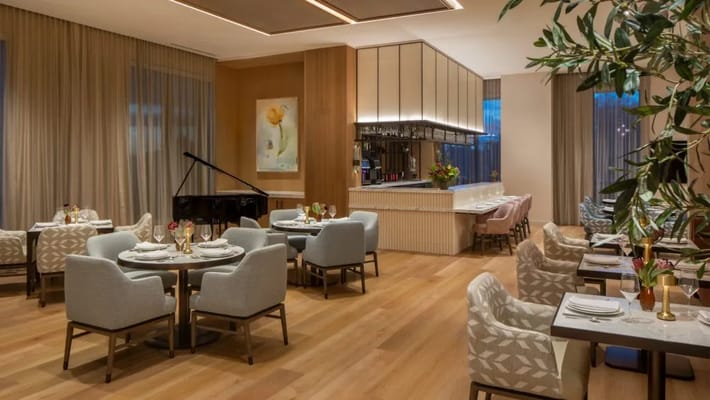 Elegant dining room with tables and a piano