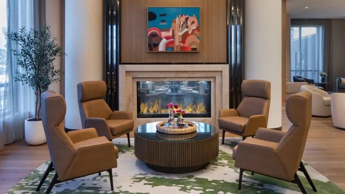 Interior seating area with modern chairs and fireplace