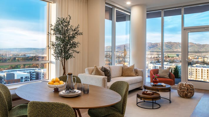 Bright interior of a senior living common area with mountain view