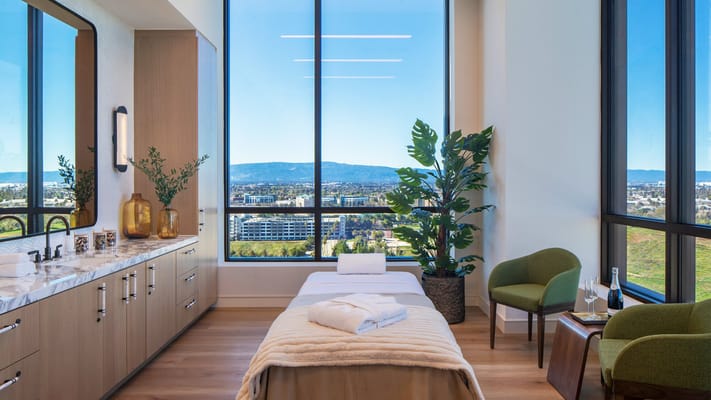 A bright and modern wellness room with a view