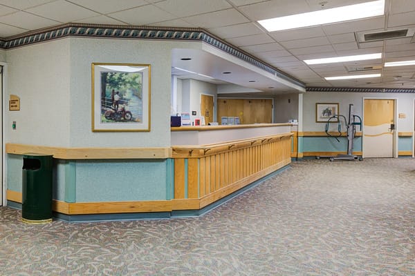 Reception area of a senior care facility with a painting