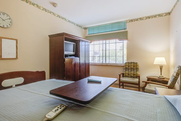 Well-furnished resident room with a window