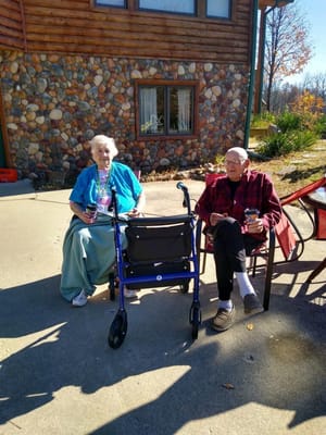 Two residents enjoying the outdoors on a sunny day