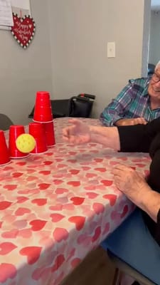 Residents enjoying a game with plastic cups