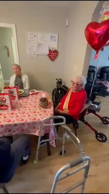 Residents celebrating with decorations and balloons