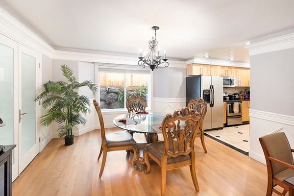 Bright dining area with wooden table and chairs