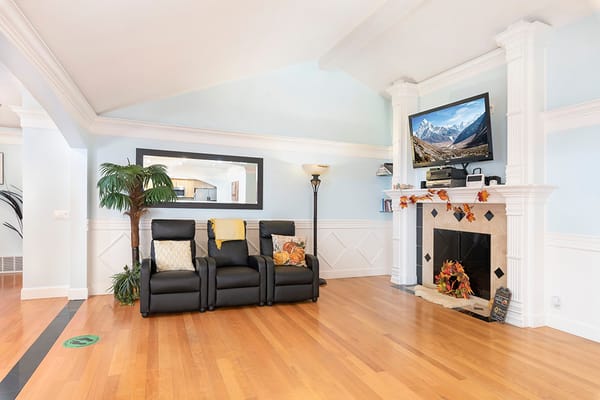 Cozy common area with armchairs and a fireplace