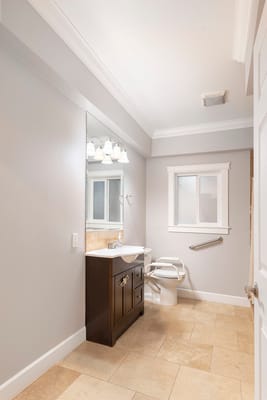 Well-lit accessible bathroom with safety features