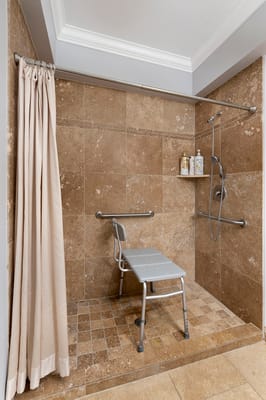 Accessible shower with seating and grab bars