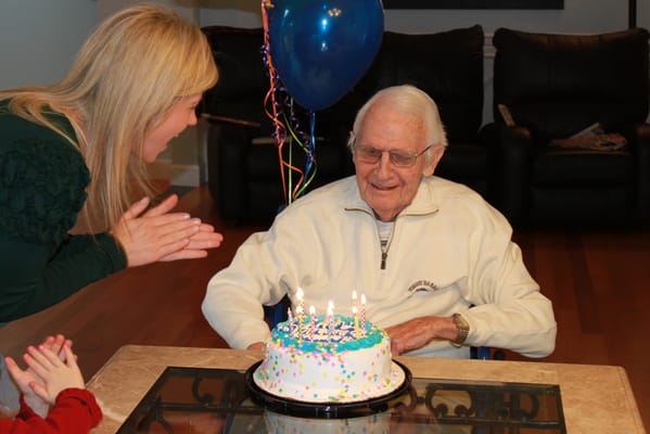 Resident celebrating a birthday with a cake