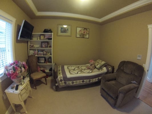 Cozy private bedroom with personal touches and decor