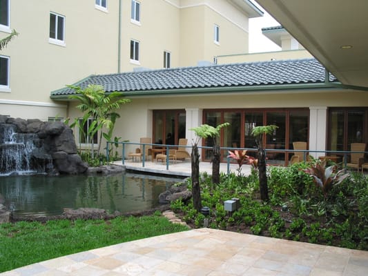 Outdoor space with a water feature and seating area