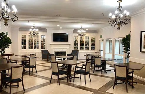 Common area with dining tables and elegant lighting