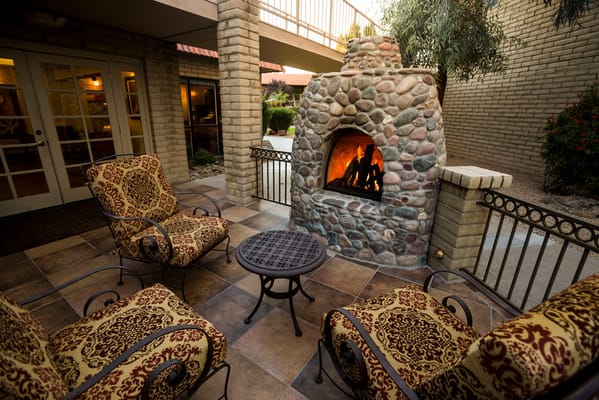 Cozy outdoor seating area with a fireplace