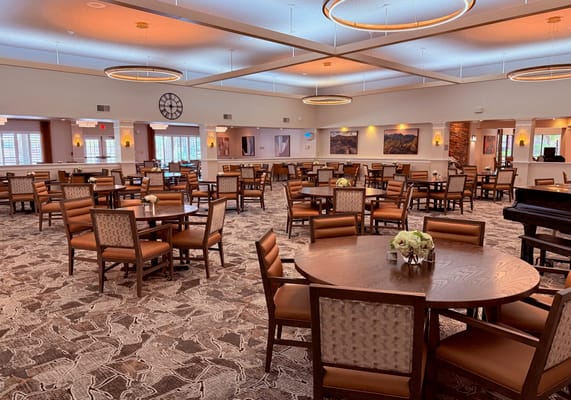 Dining area with tables and chairs in a common room