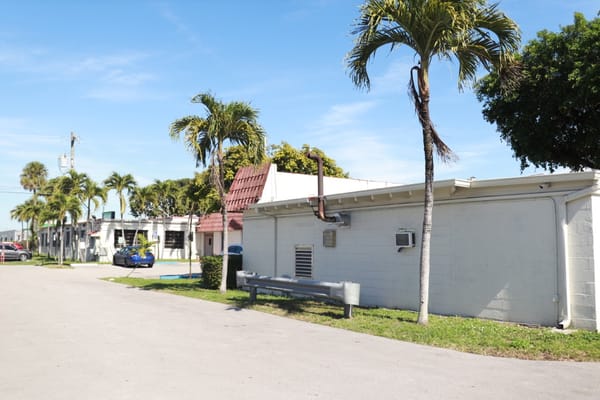 Side view of the facility with palm trees