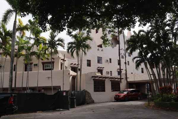 Exterior view of a nursing facility surrounded by greenery