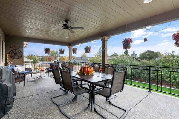 Outdoor patio area with seating and seasonal decorations