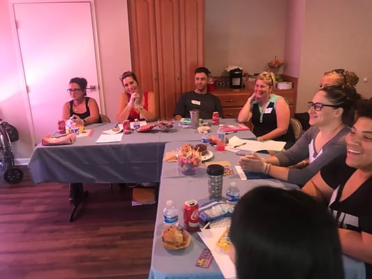 Participants laughing during an activity session with snacks