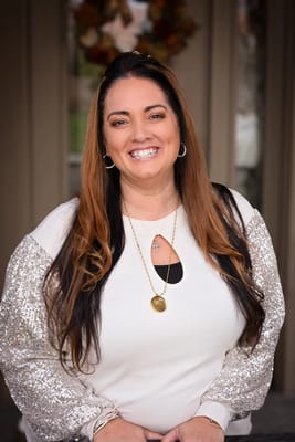 Staff member smiling outside the facility