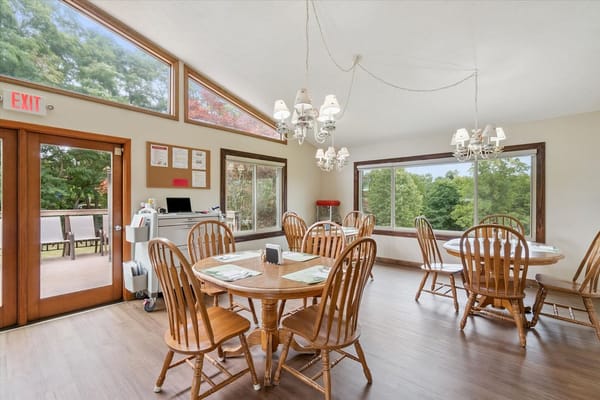 Bright dining room with wooden tables and chairs