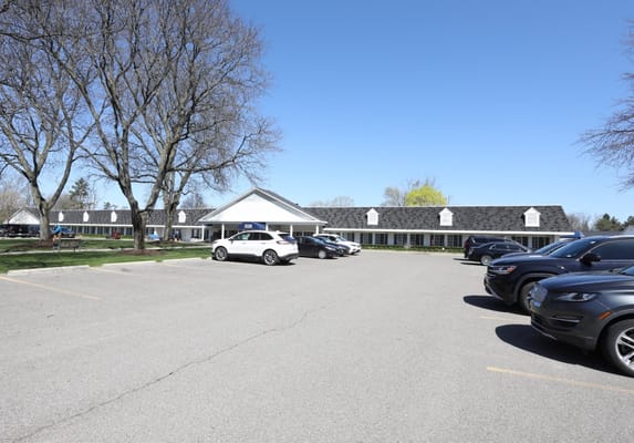 Exterior view of American House Dearborn Heights with parking lot