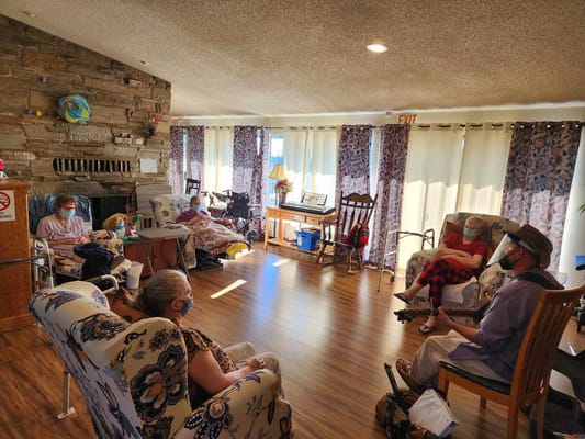 Residents enjoying music in a cozy common area