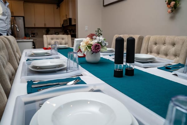 Dining table set for a meal in a modern interior