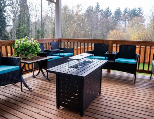 Outdoor patio area with seating and fire table