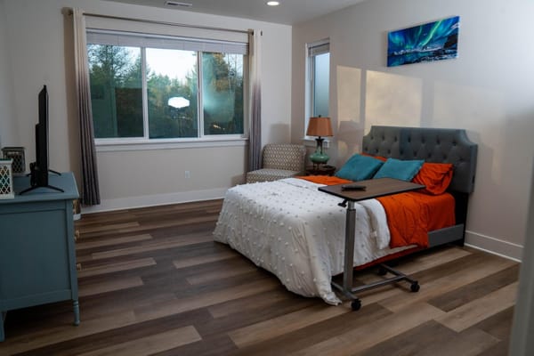 Bright and cozy bedroom with a large window