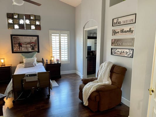 Cozy resident room with comfortable chair and decor