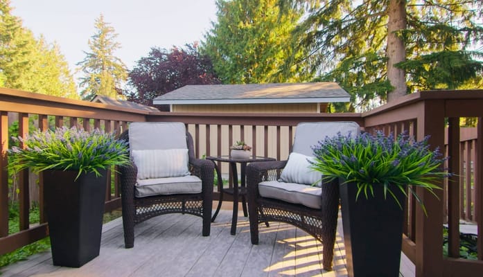 Cozy outdoor seating area with flower pots