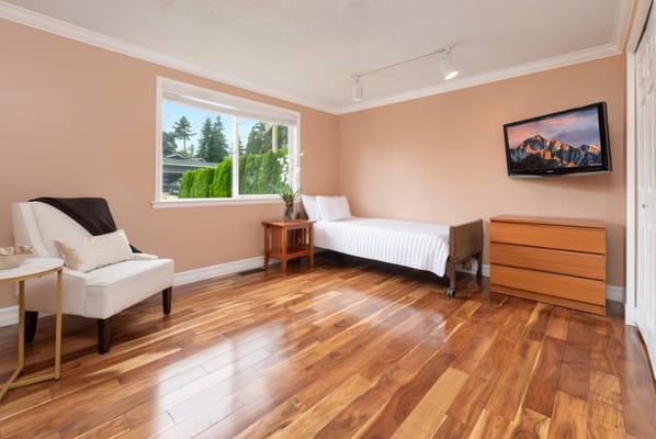 Bright personal room with wooden floor and natural light