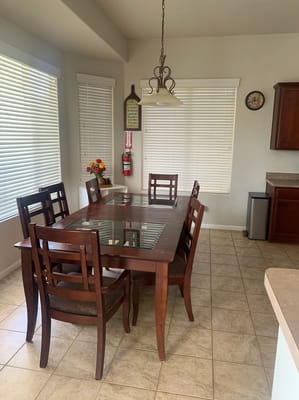 Dining room with a large wooden table and chairs